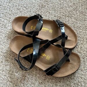 Birkenstock Women's Sandals with Black Straps and Brown Footbed